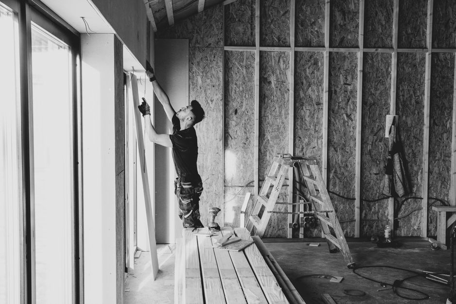 Professional contractor performing precision window installation