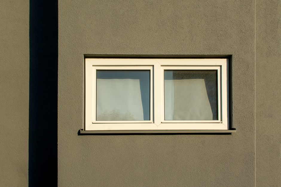 Close up of energy efficient windows with white vinyl frames